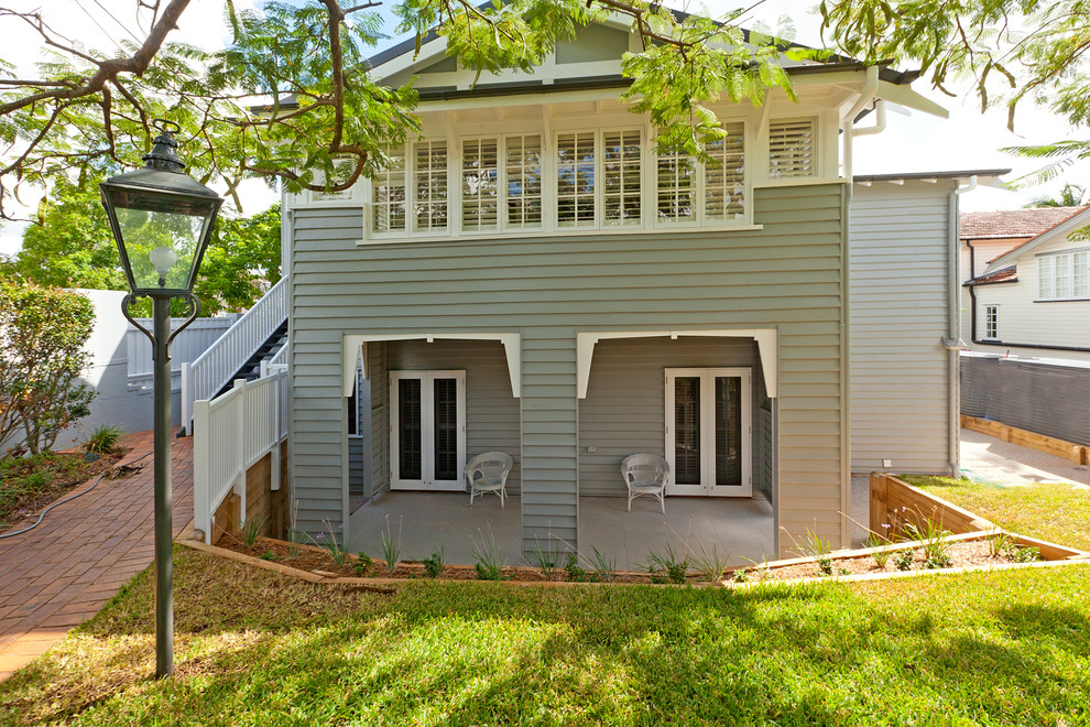 Inspiration for a large timeless gray two-story wood exterior home remodel in Brisbane with a metal roof