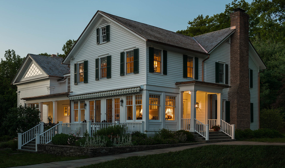 Example of a mid-sized country white two-story wood gable roof design in New York with a shingle roof