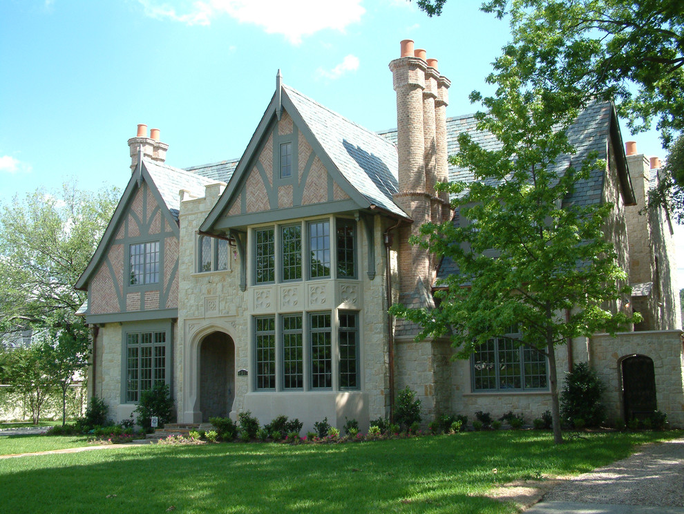 Example of a large classic multicolored two-story mixed siding exterior home design in Dallas with a shingle roof