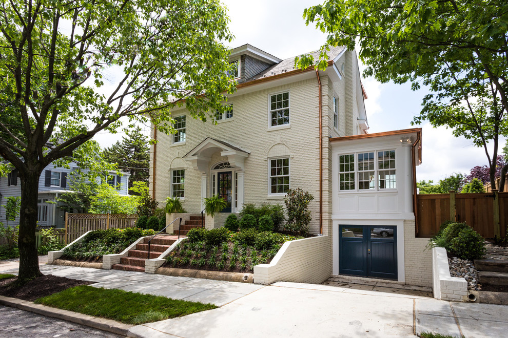 Inspiration for a beige classic two floor brick house exterior in DC Metro.