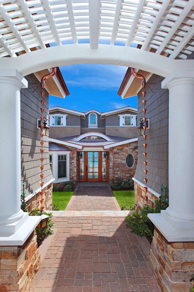 Mid-sized traditional green three-story mixed siding gable roof idea in Orange County