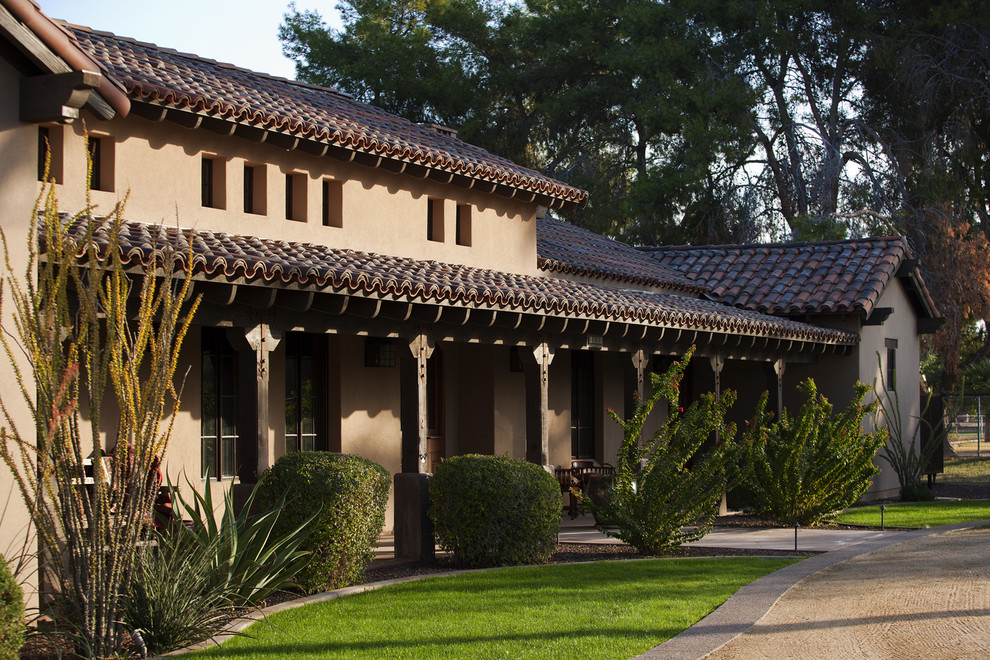 Southwest exterior home photo in Phoenix with a tile roof