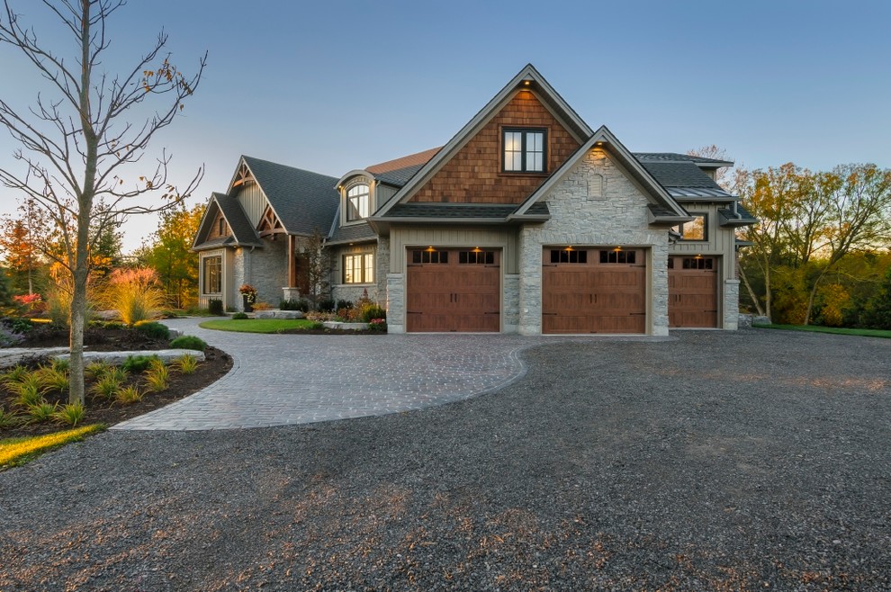 Large arts and crafts multicolored two-story mixed siding exterior home photo in Cincinnati with a mixed material roof