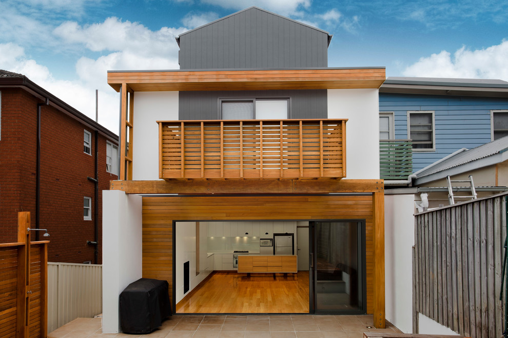 Стильный дизайн: дом в стиле модернизм с облицовкой из цементной штукатурки - последний тренд