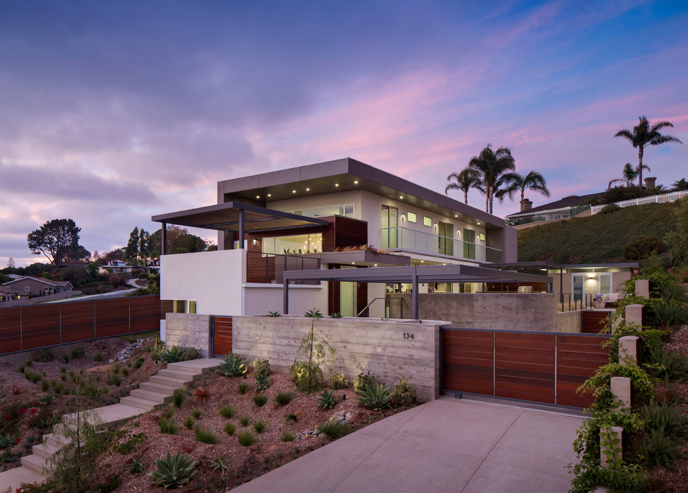 Photo of a large and white beach style two floor house exterior in San Diego with mixed cladding and a flat roof.