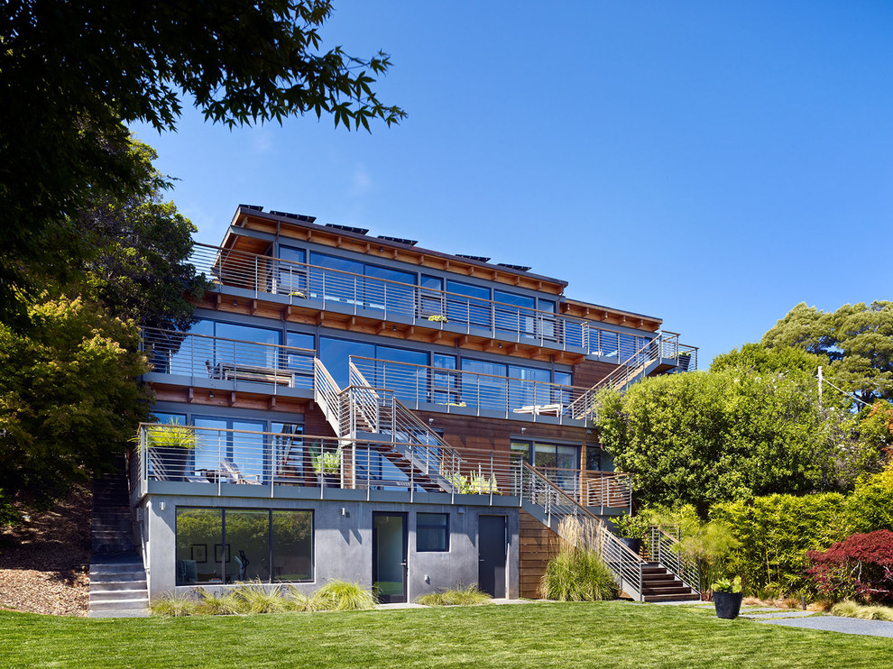 Expansive contemporary glass house exterior in San Francisco with three floors and a flat roof.