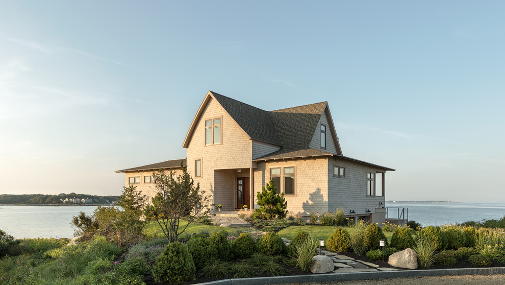 Example of a beach style exterior home design in Portland Maine