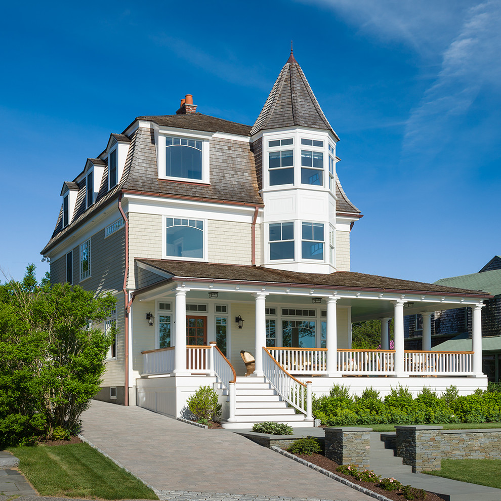 This is an example of a victorian house exterior in Providence with wood cladding.