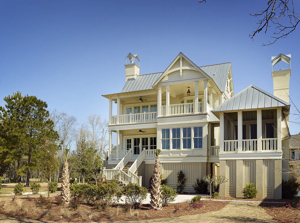 Photo of a coastal two floor house exterior in Charleston with wood cladding.