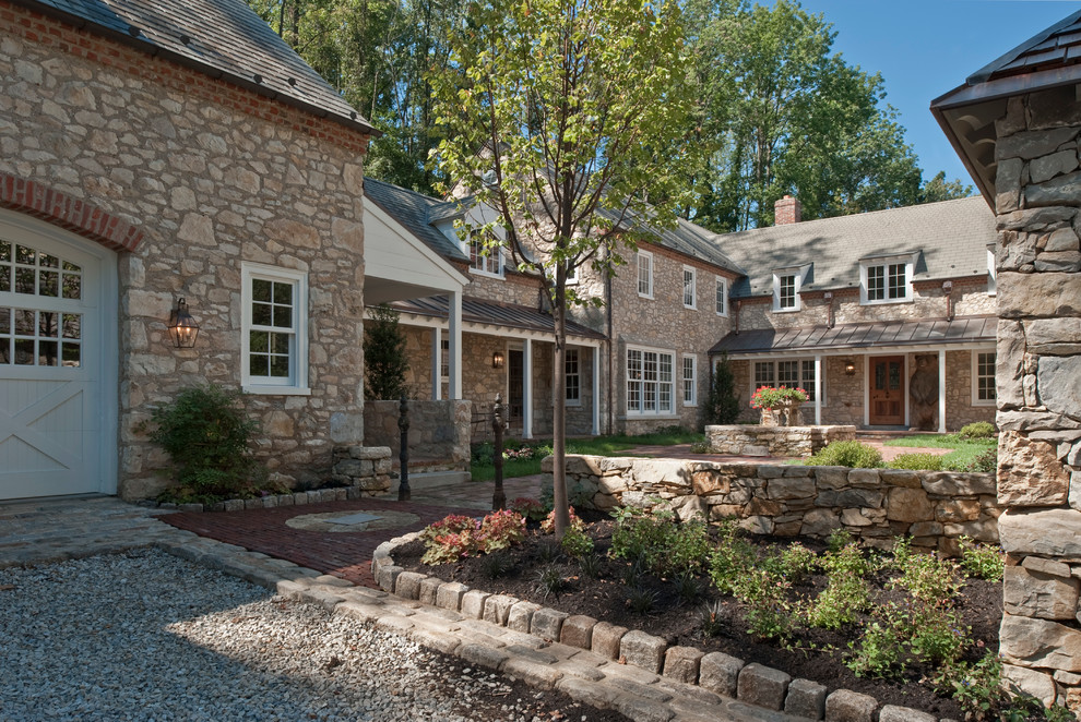 Cottage two-story stone gable roof photo in Philadelphia