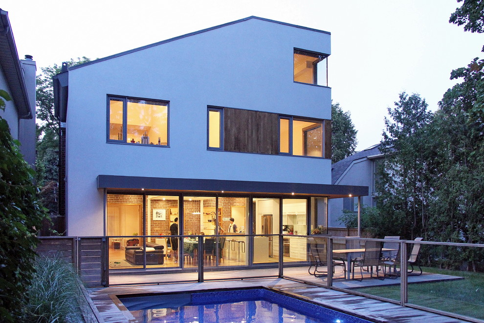 Inspiration for a mid-sized contemporary white two-story stucco exterior home remodel in Toronto