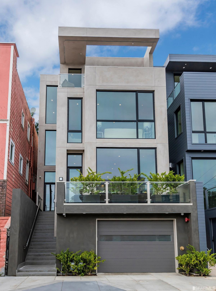 Large and gey contemporary render house exterior in San Francisco with four floors and a flat roof.