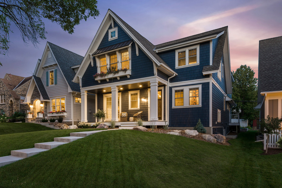 Inspiration for a transitional blue wood house exterior remodel in Minneapolis with a shingle roof