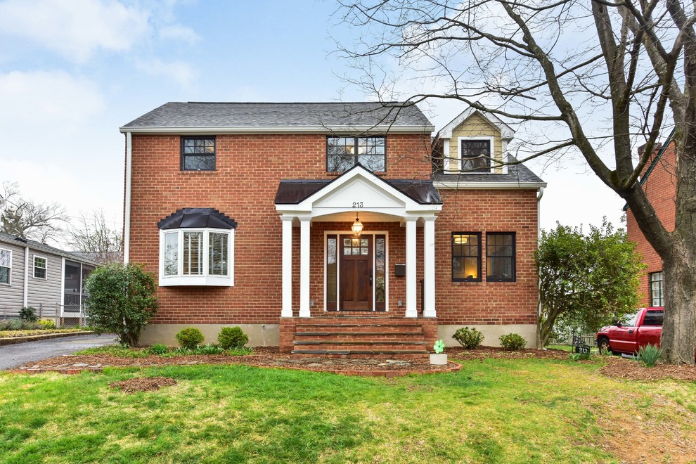 Inspiration for a mid-sized timeless beige three-story mixed siding house exterior remodel