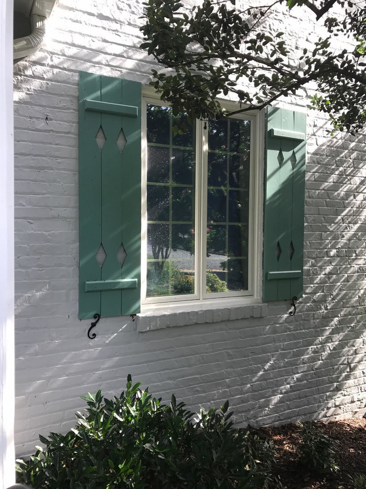 Mid-sized traditional white one-story brick exterior home idea in DC Metro with a shingle roof