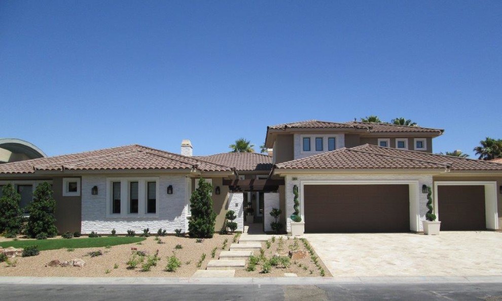 Mid-sized transitional beige two-story mixed siding exterior home photo in Las Vegas with a hip roof