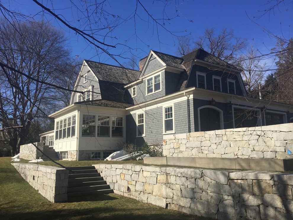 Example of a large classic gray two-story wood exterior home design in Boston with a shingle roof