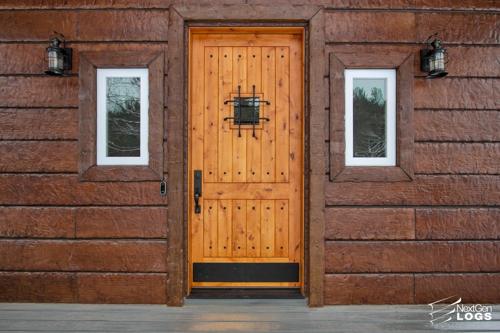 Foto de fachada marrón rústica con revestimiento de hormigón