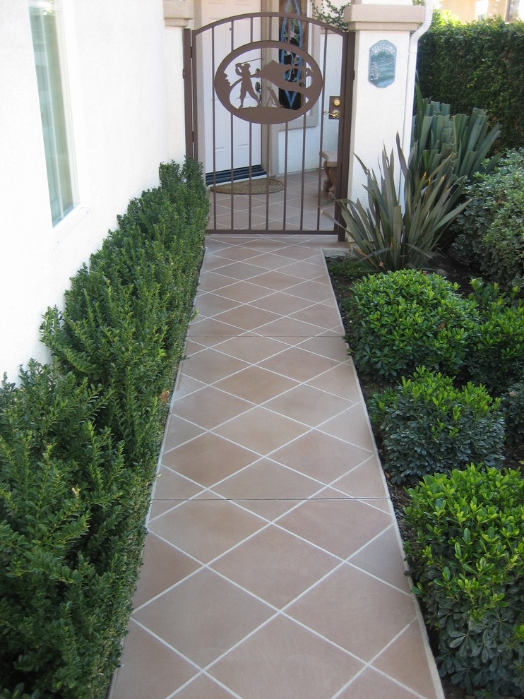 Inspiration for a mid-sized timeless beige two-story wood flat roof remodel in San Diego