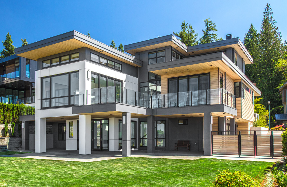 Großes, Zweistöckiges Modernes Einfamilienhaus mit Mix-Fassade, Flachdach, bunter Fassadenfarbe und Blechdach in Seattle
