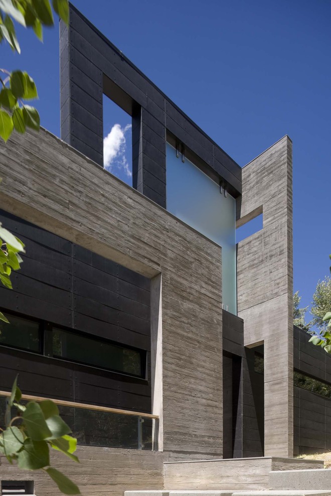 Expansive contemporary two floor concrete house exterior in Denver.