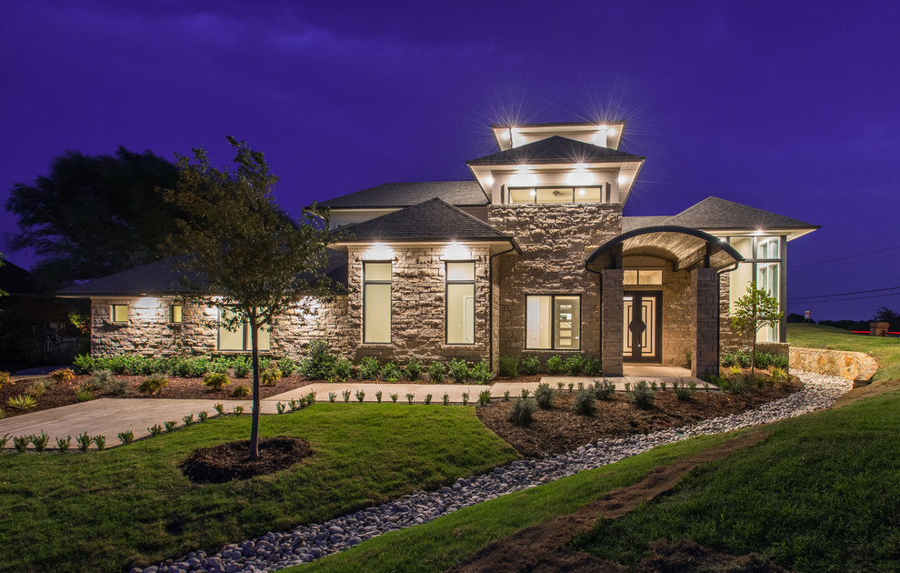 Large transitional beige two-story stone exterior home photo in Dallas