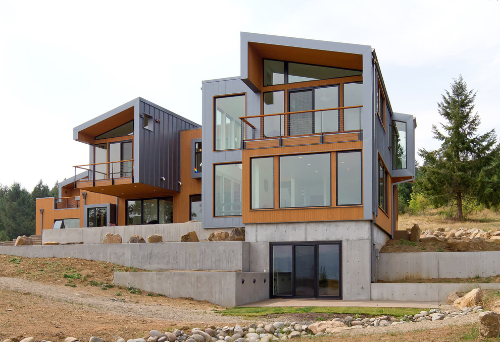 Example of a trendy metal exterior home design in Portland