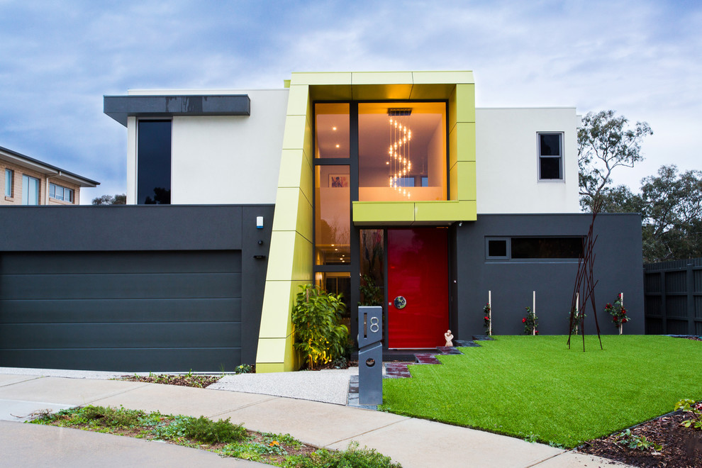 Design ideas for a contemporary two floor house exterior in Geelong with a flat roof.