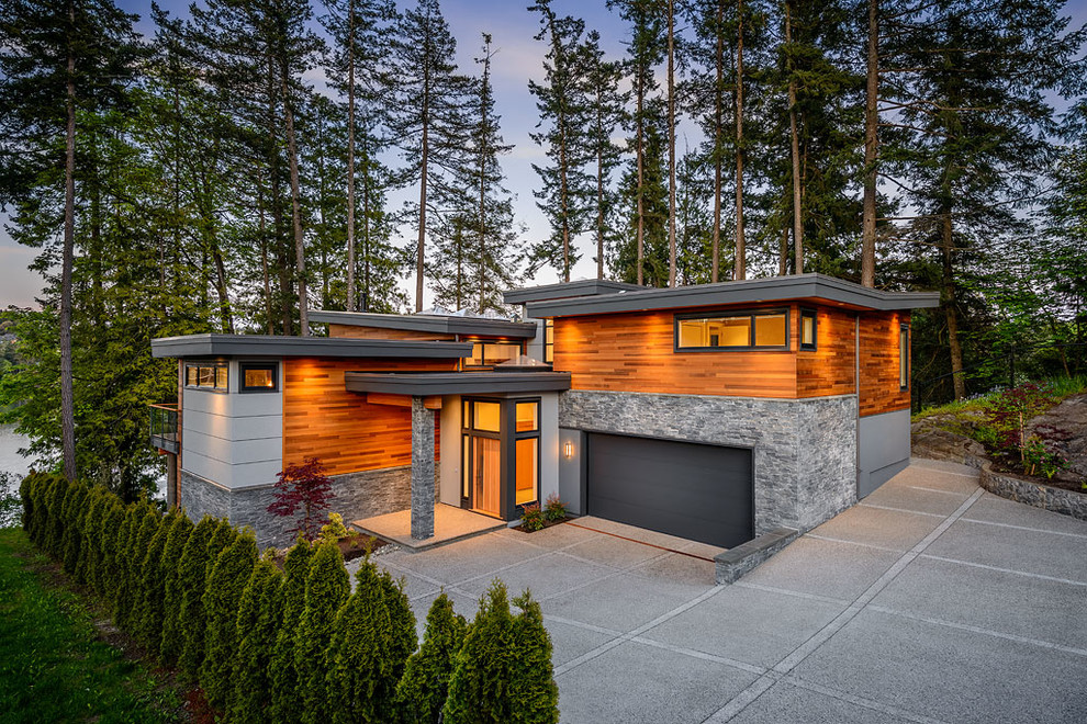 Design ideas for a contemporary two floor house exterior in Vancouver.