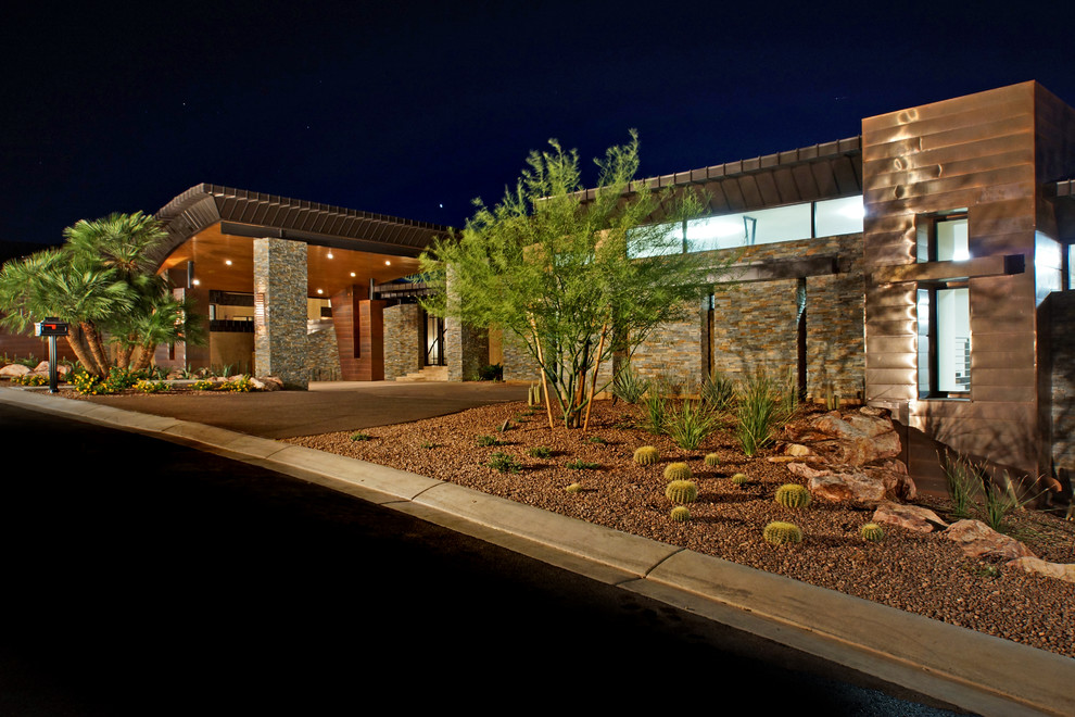 Design ideas for a contemporary house exterior in Las Vegas with stone cladding.