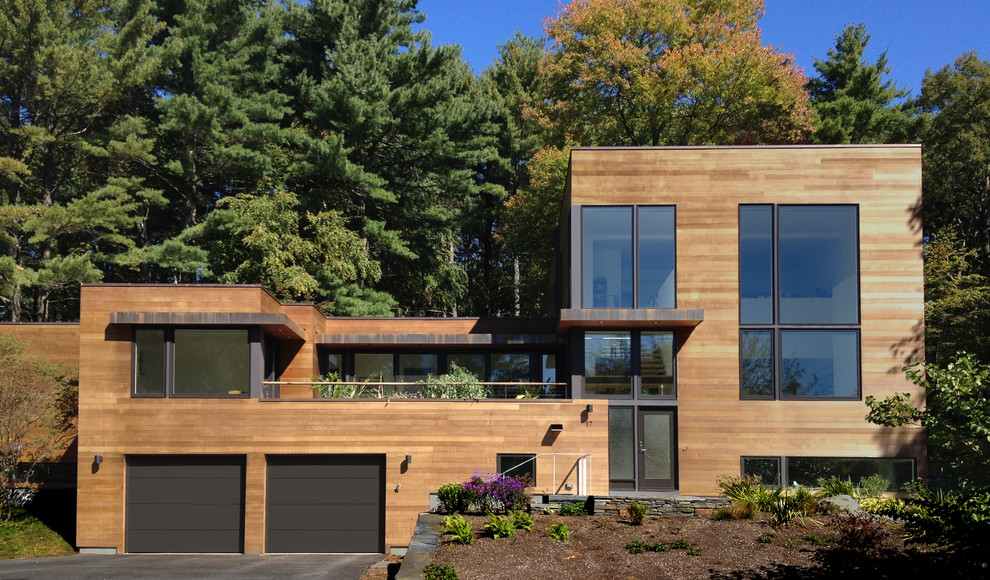 This is an example of a contemporary house exterior in Boston with wood cladding.