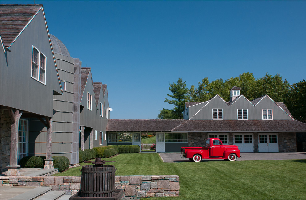 Example of a farmhouse gray two-story exterior home design in New York