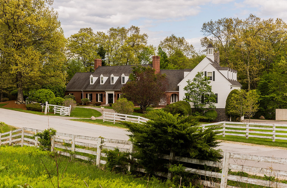 Inspiration for a huge transitional white brick exterior home remodel in Manchester