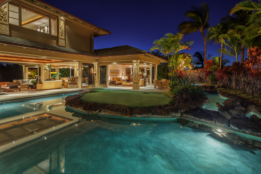 Photo of an expansive world-inspired two floor house exterior in Hawaii.