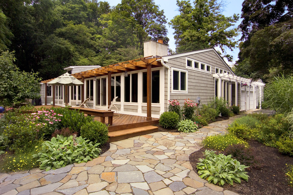 Inspiration for a contemporary gray one-story mixed siding house exterior remodel in Other with a mixed material roof