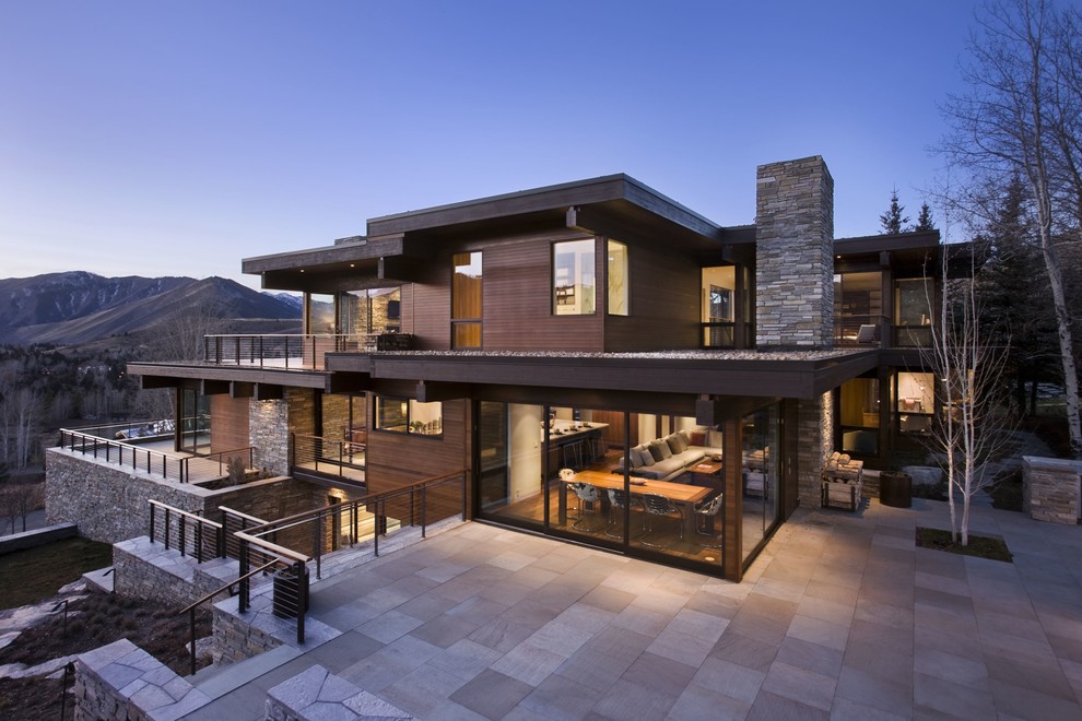 Contemporary three-storey exterior in Boise with wood siding and a flat roof.