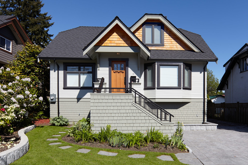 This is an example of a classic house exterior in Vancouver with wood cladding.