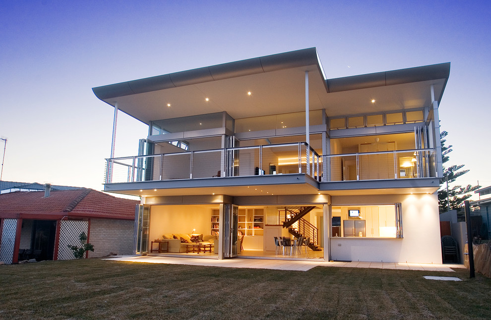 Large and white contemporary two floor concrete detached house in Sydney with a flat roof.