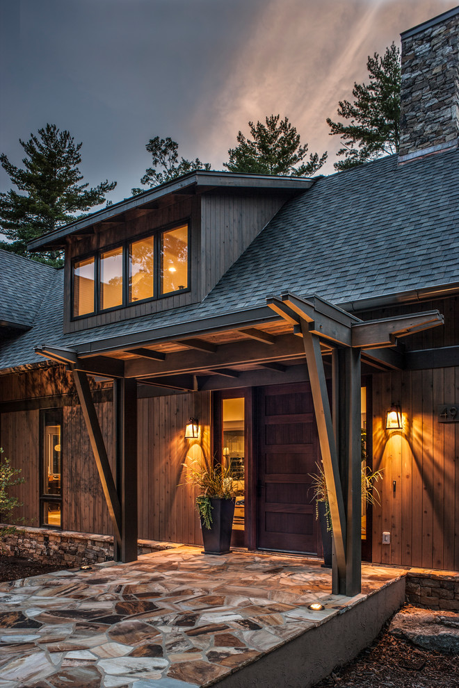 Mid-sized rustic gray two-story wood house exterior idea in Other with a shingle roof