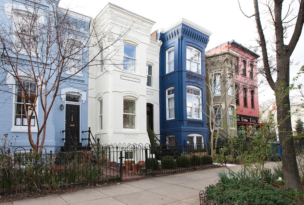 Ornate three-story exterior home photo in DC Metro