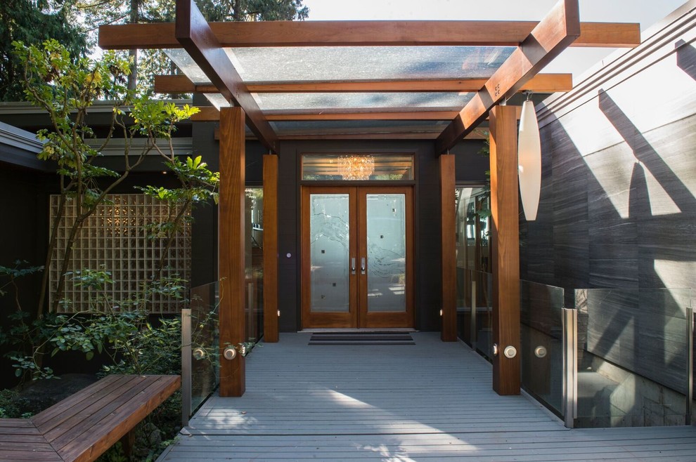 Inspiration for a mid-sized contemporary gray two-story mixed siding flat roof remodel in Vancouver