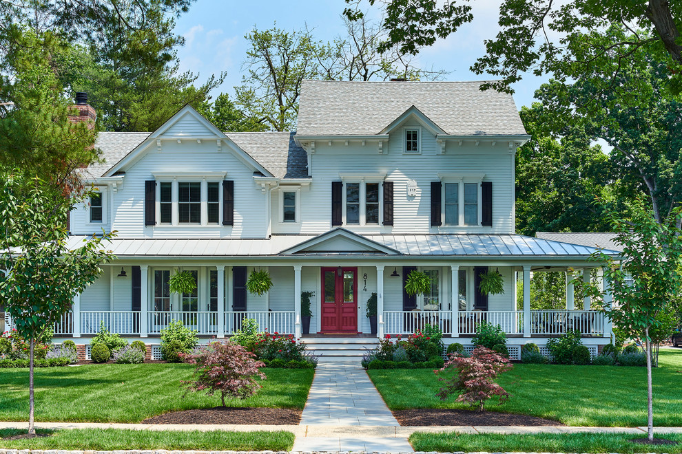 Inspiration for a timeless white two-story exterior home remodel in New York with a shingle roof
