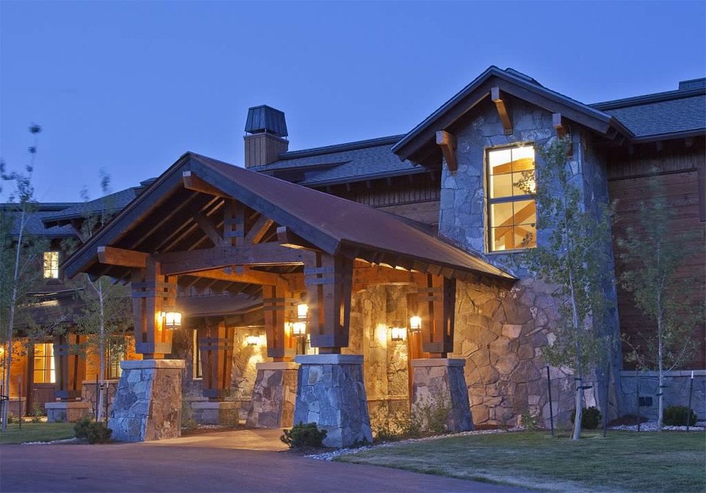 Photo of an expansive and brown rustic two floor house exterior in Denver with mixed cladding and a hip roof.