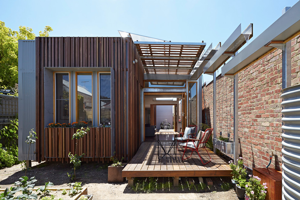 Trendy one-story brick exterior home photo in Melbourne