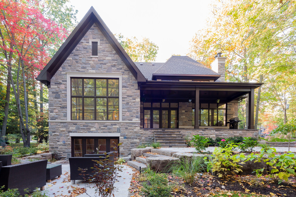 Example of a large classic two-story stone exterior home design in Toronto