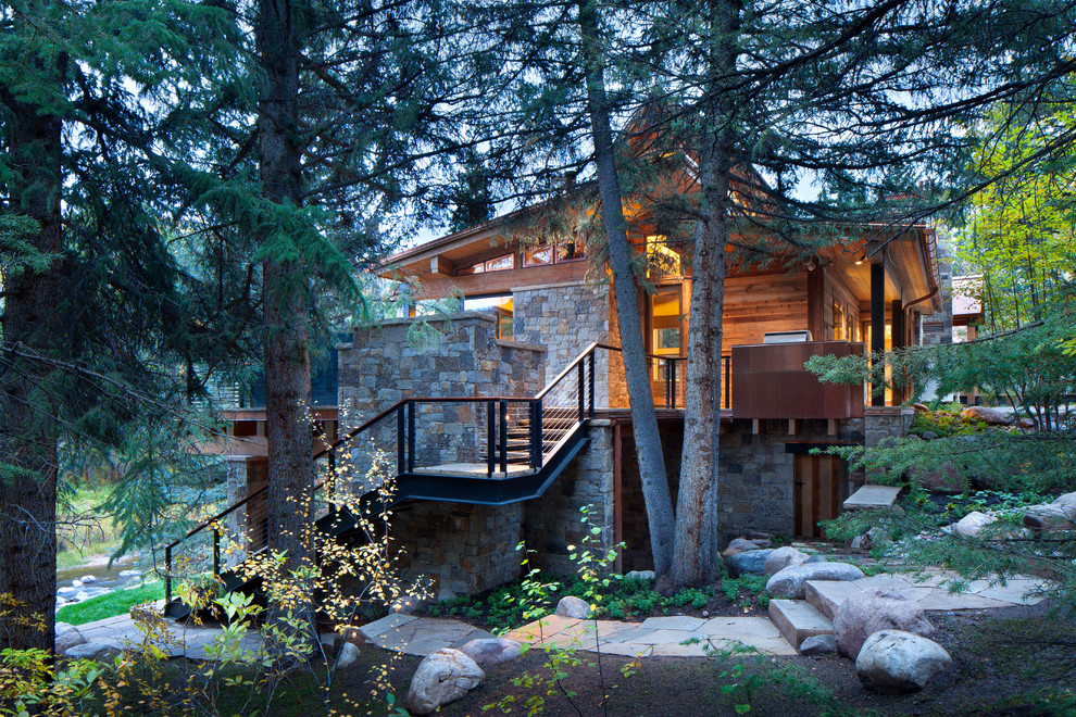 Photo of a contemporary two floor house exterior in Denver with wood cladding.