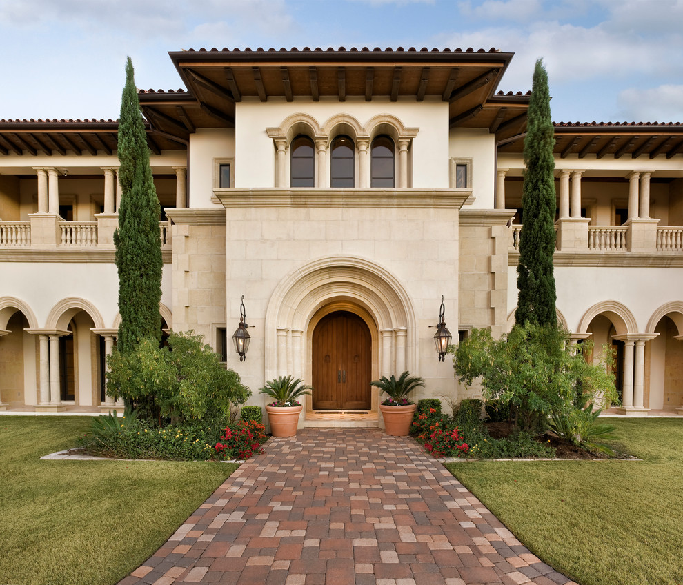 Photo of an expansive mediterranean two floor house exterior in Austin.