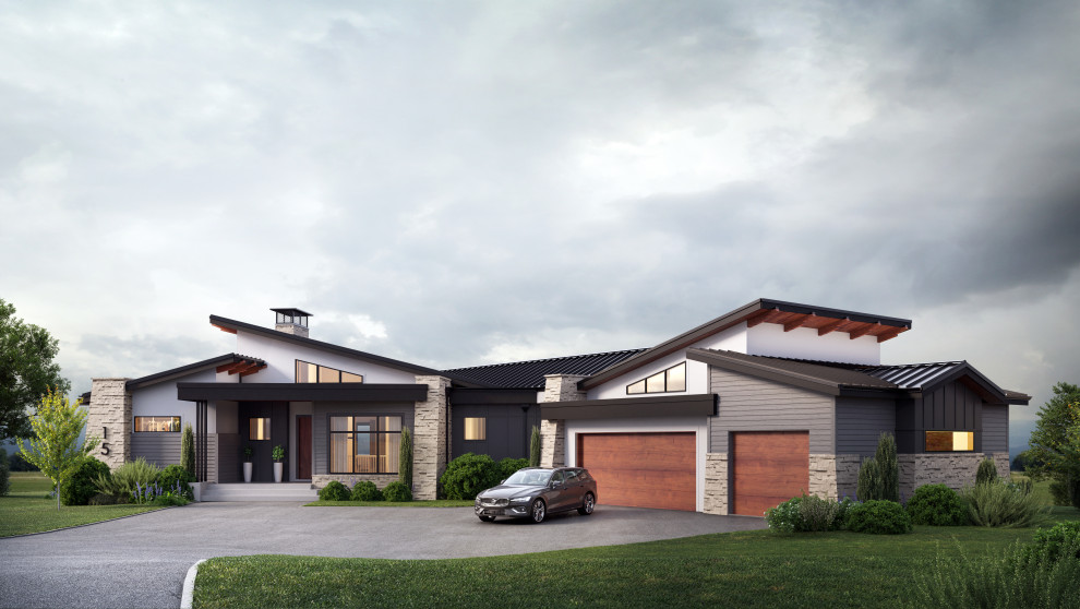 Large and white modern bungalow detached house in Calgary with stone cladding.