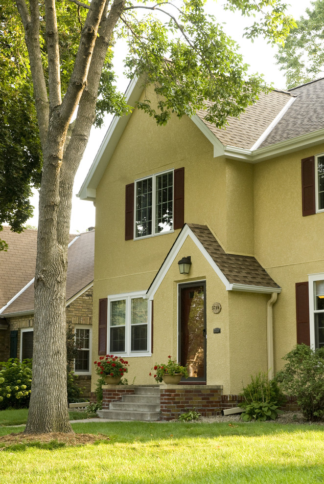 Example of an arts and crafts exterior home design in Minneapolis