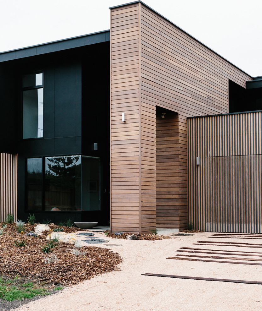 Inspiration for a contemporary two-story flat roof remodel in Geelong